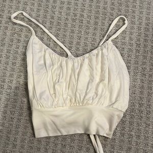 Diosa Top sold from Boujee. Size Medium white top that ties in the back.